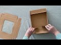 Caja de regalo de papel con ventana y cinta